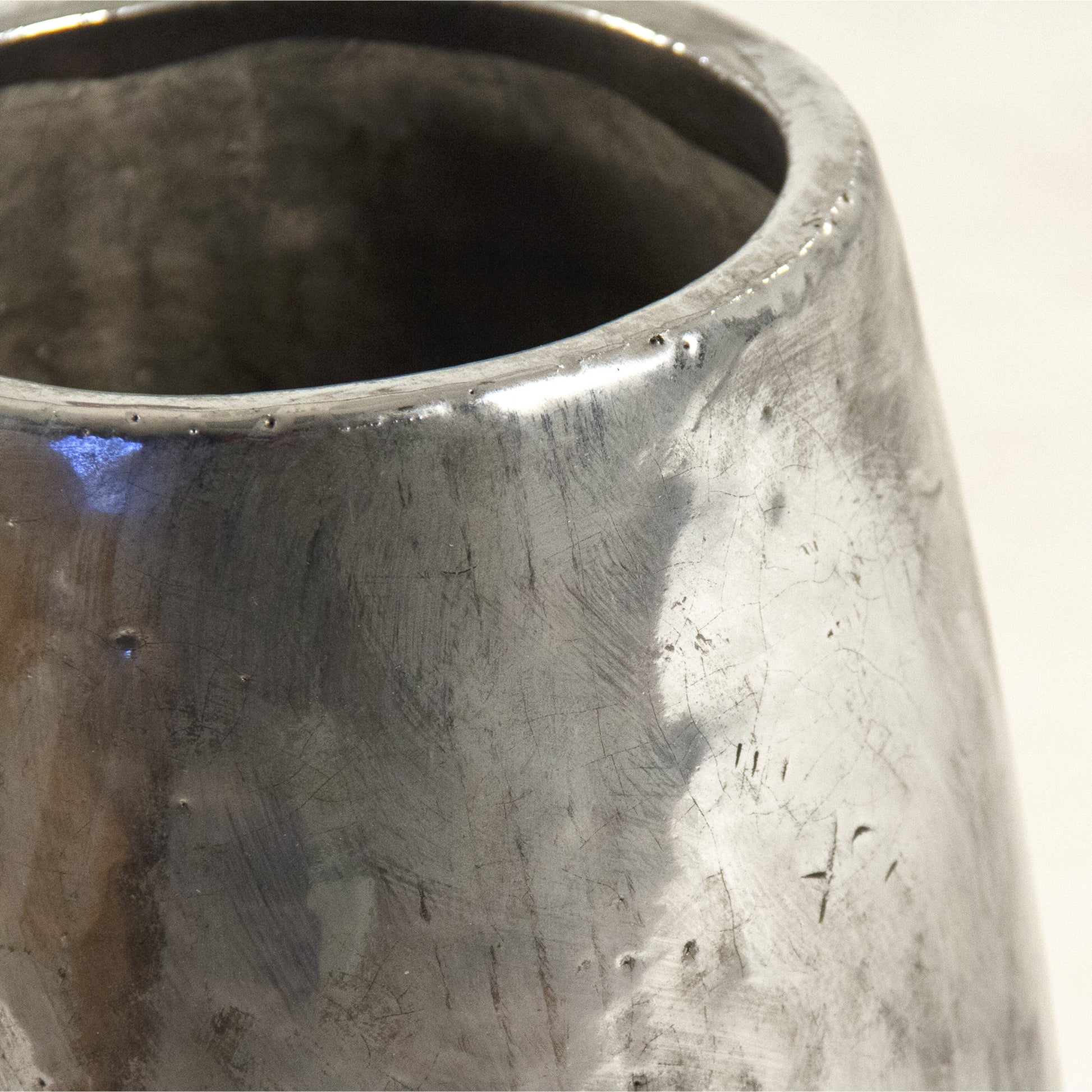 Distressed Metallic Vase by Zentique in distressed metallic silver. Made from stoneware in a transitional style.