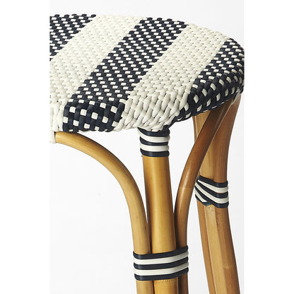Tobias Wood Bar Stool by Butler Specialty Company. Made from rattan, polyurethane synthetic rattan in a coastal style.