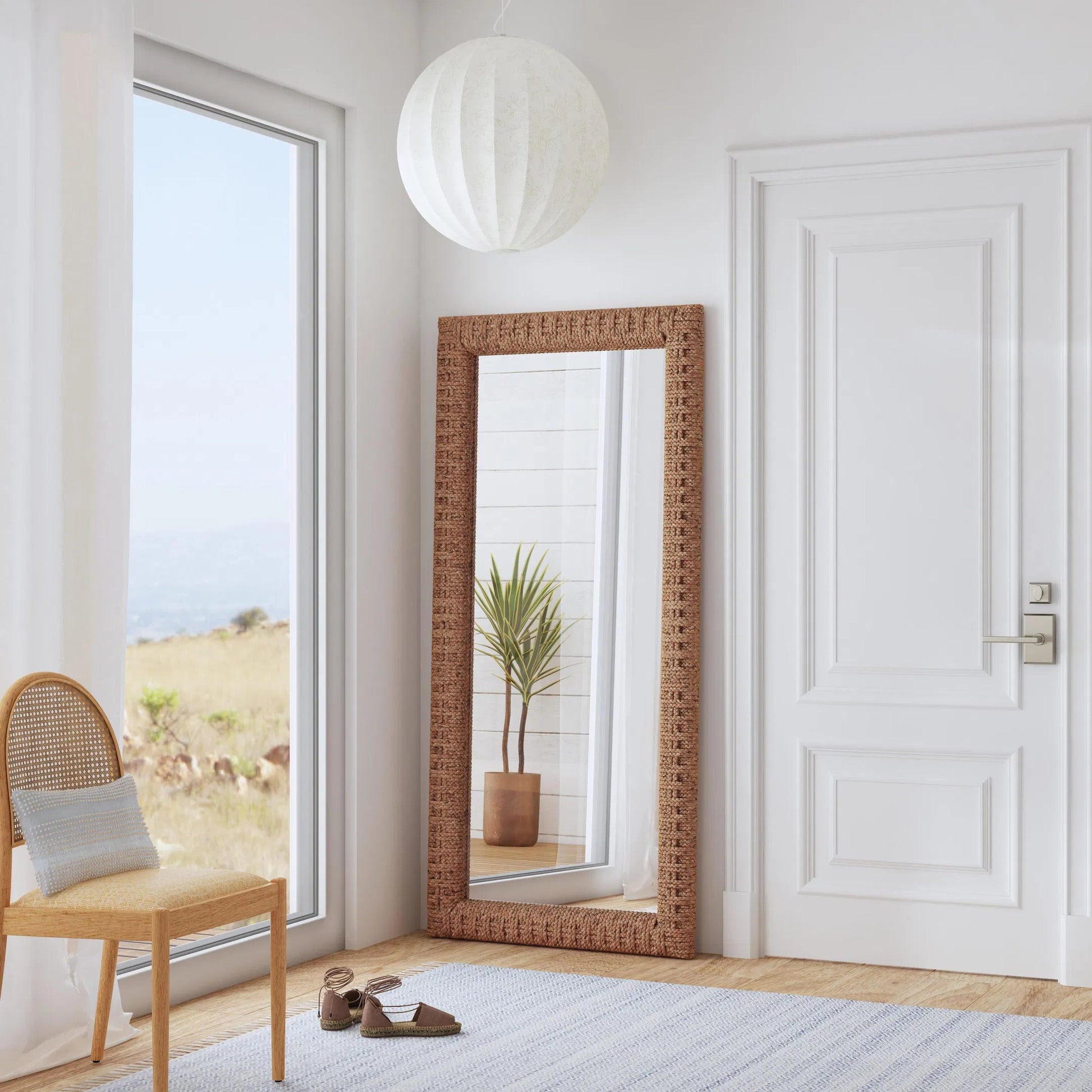 Gloucester Woven Water Hyacinth Floor Mirror by Butler Specialty Company in brown. Made from plywood, glass in a rustic style.