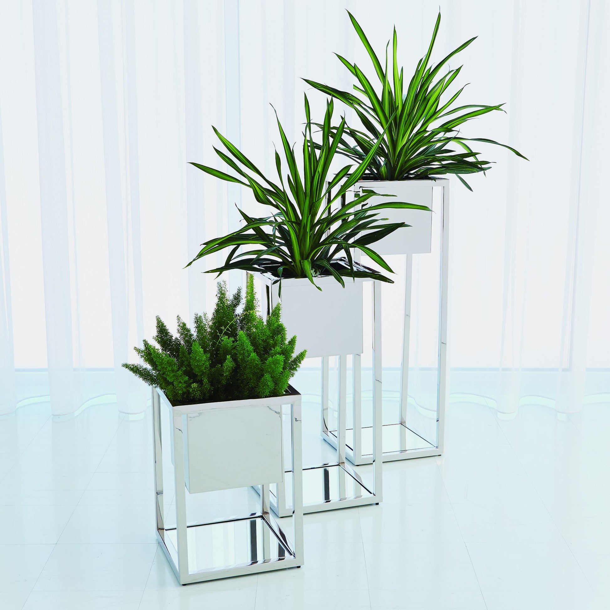 Escher Pedestal Planter by Global Views. Made from unique in a modern style.