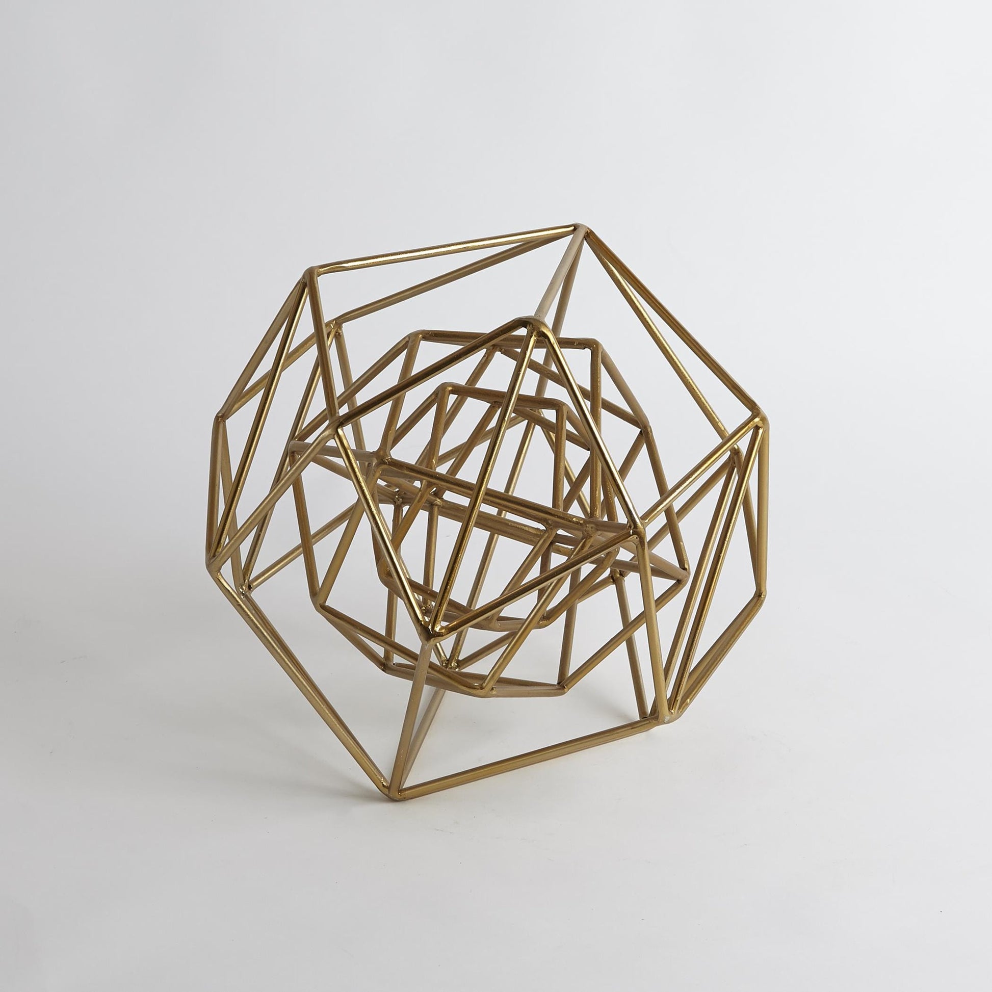 Geo Sculpture by Global Views in gold. Made from iron in a modern style.