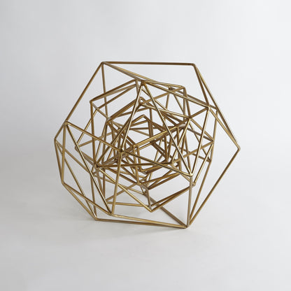 Geo Sculpture by Global Views in gold. Made from iron in a modern style.