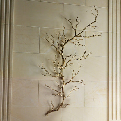 Twig Wall Art by Global Views. Made from brass in a modern style.