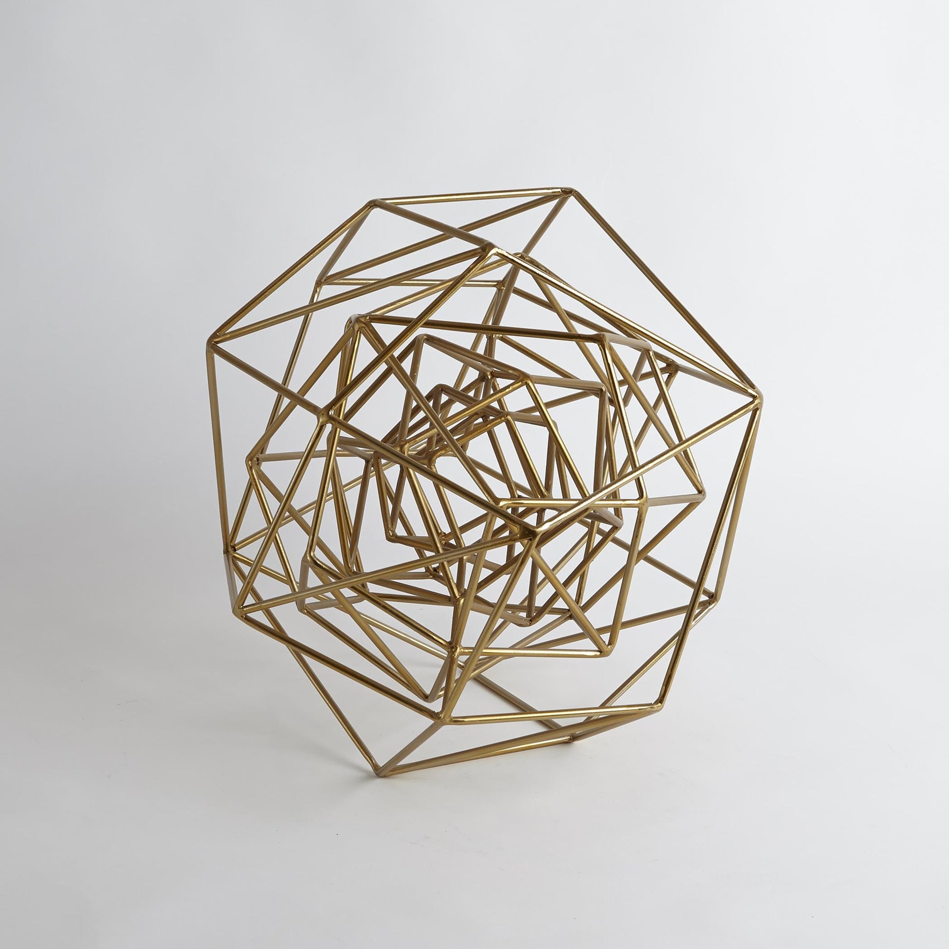 Geo Sculpture by Global Views in gold. Made from iron in a modern style.