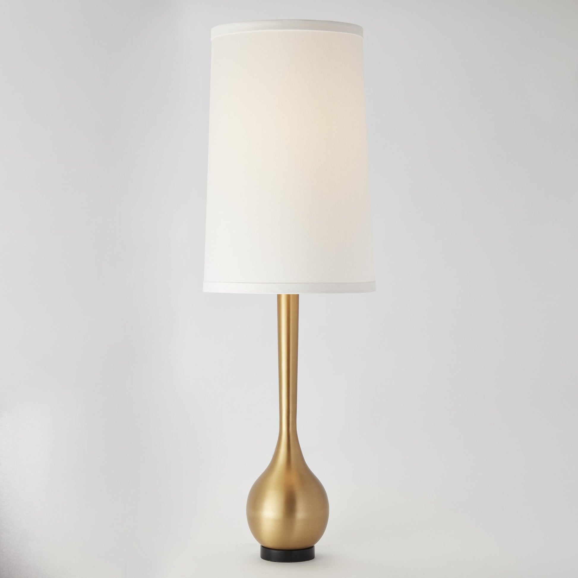 Bulb Vase Table Lamp by Global Views. Made from brass, black lime stone in a transitional style.