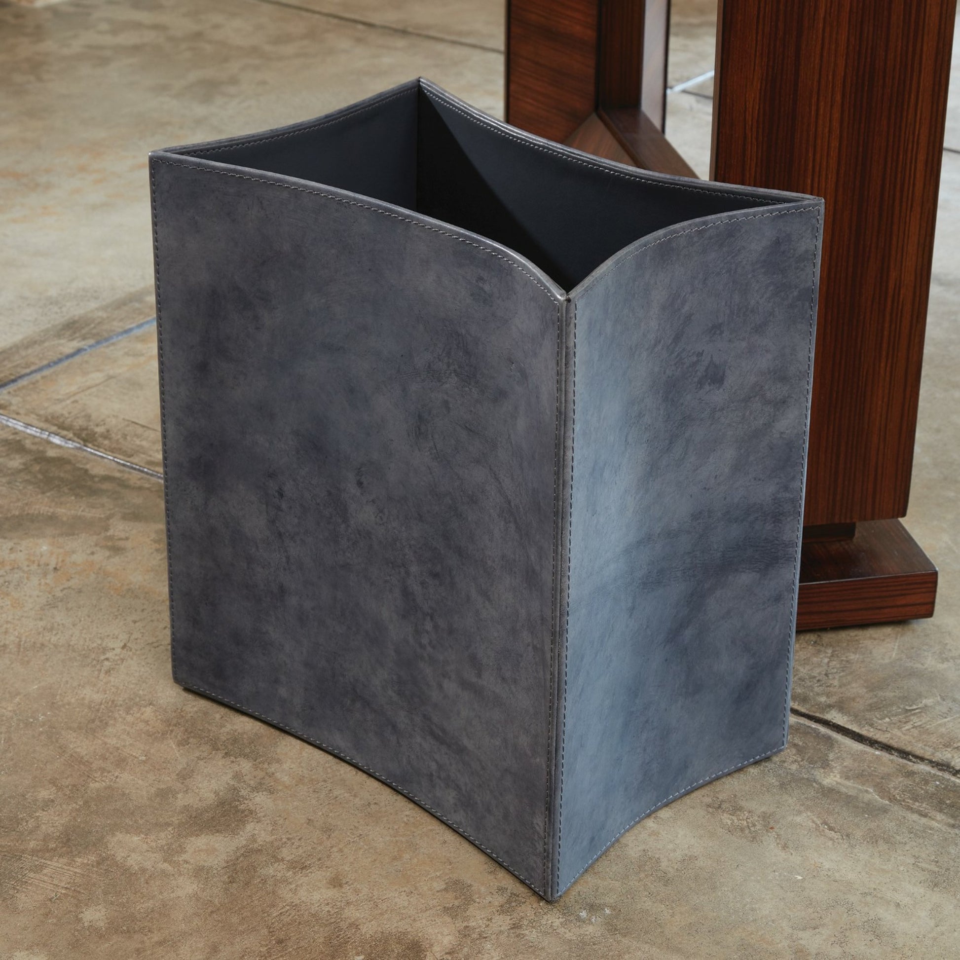 Folded Leather Wastebasket by Global Views. Made from leather in a modern style.