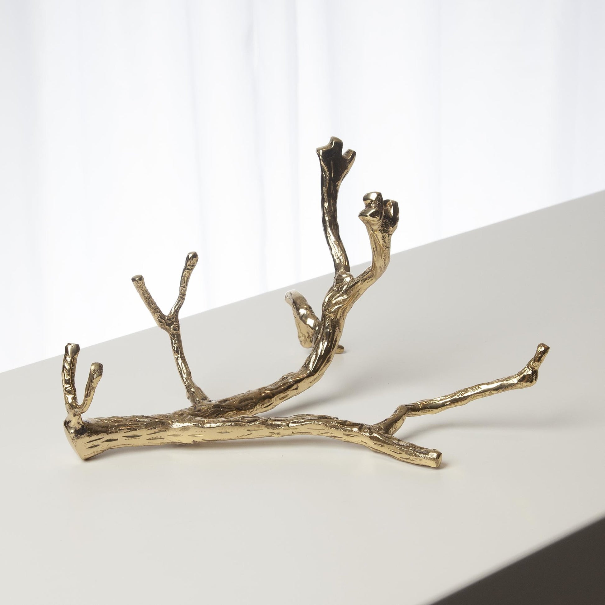 Twig Wine Bottle Holder by Global Views. Made from cast brass in a eclectic & global style.