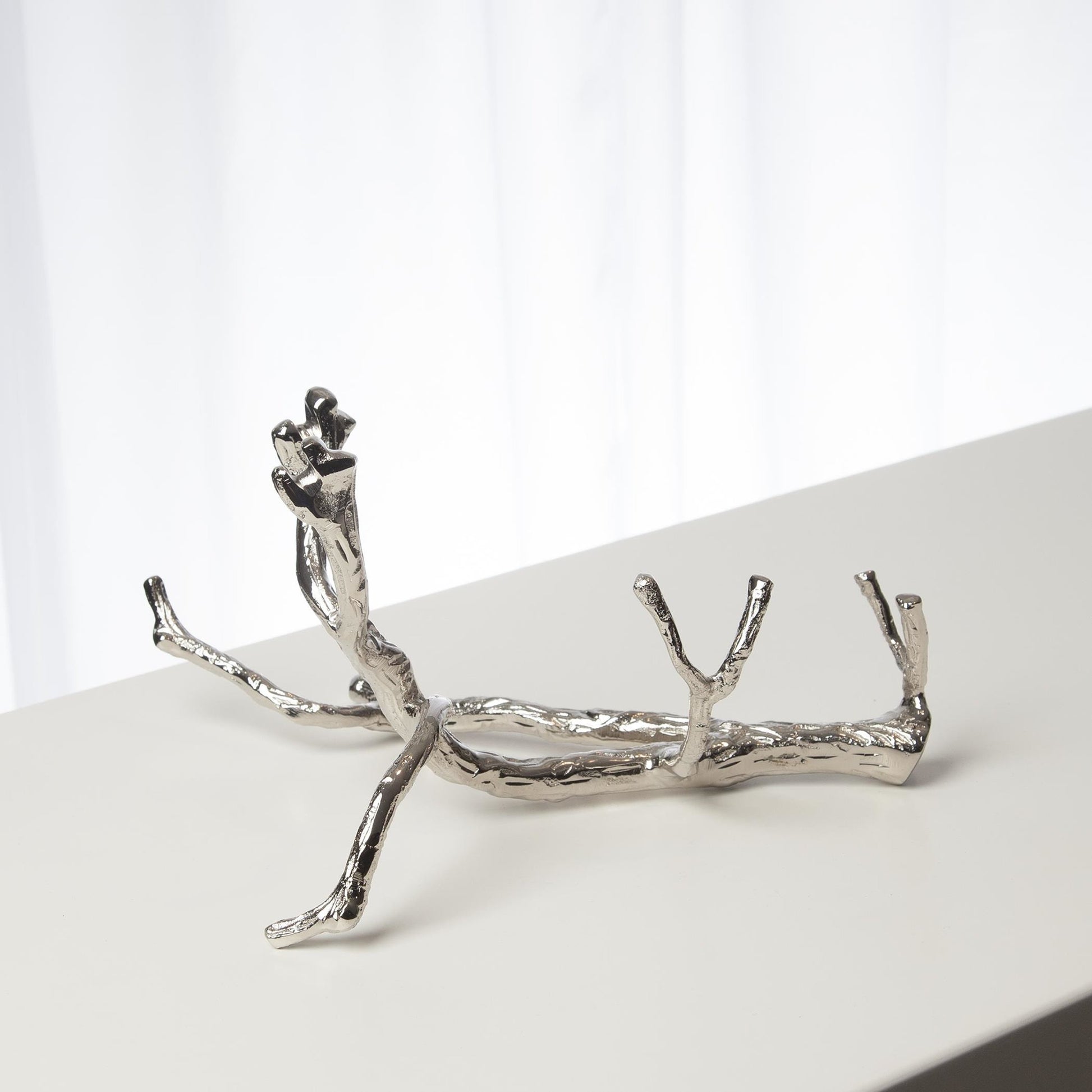 Twig Wine Bottle Holder by Global Views. Made from cast brass in a eclectic & global style.