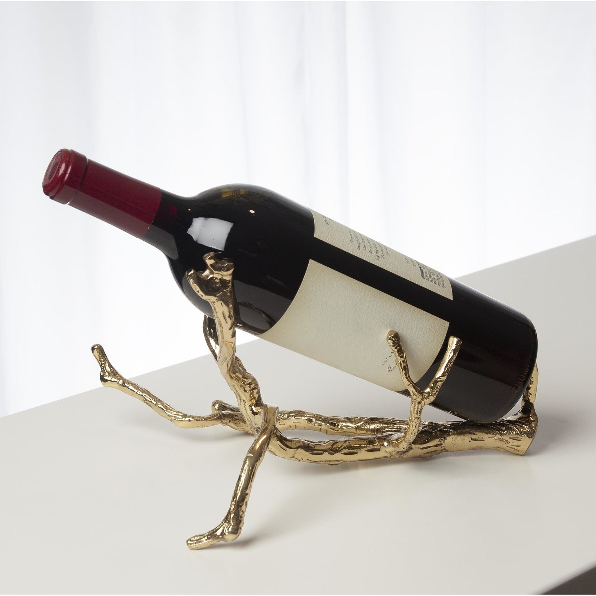 Twig Wine Bottle Holder by Global Views. Made from cast brass in a eclectic & global style.