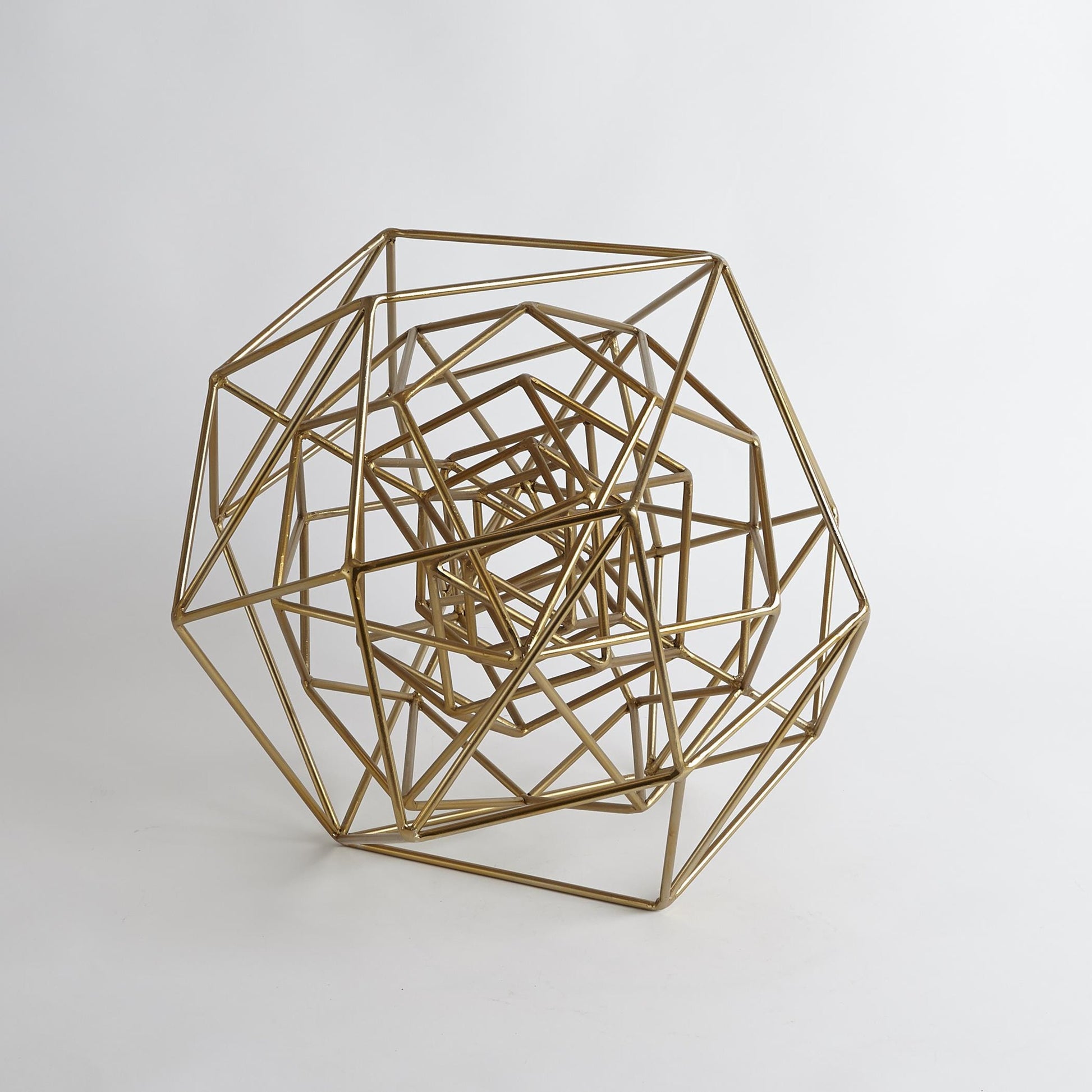 Geo Sculpture by Global Views in gold. Made from iron in a modern style.