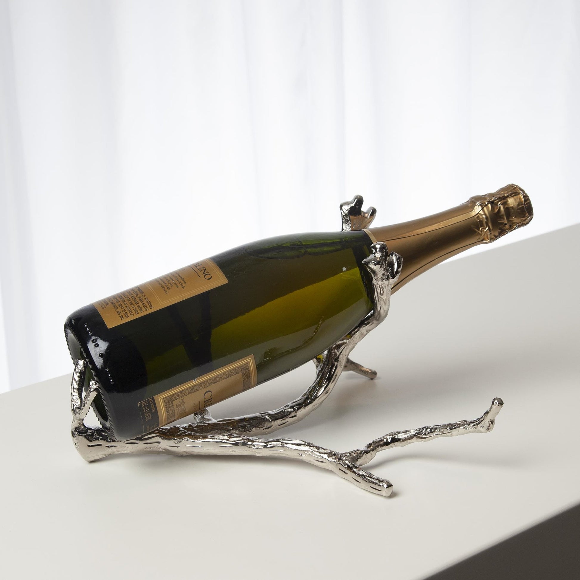 Twig Wine Bottle Holder by Global Views. Made from cast brass in a eclectic & global style.