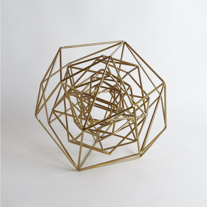 Geo Sculpture by Global Views in gold. Made from iron in a modern style.