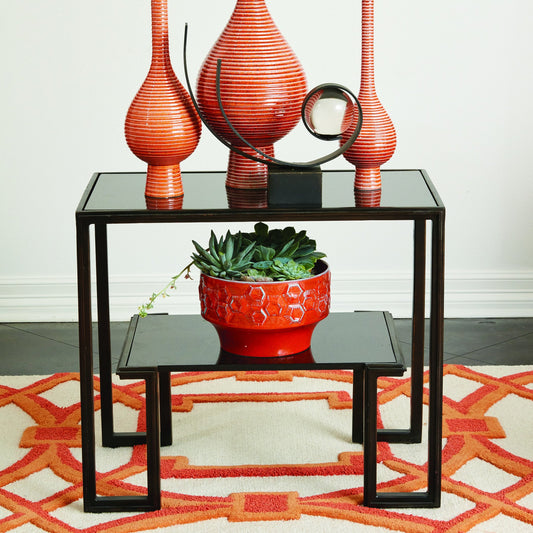One-Up Table by Global Views in bronze. Made from iron, granite in a modern style.
