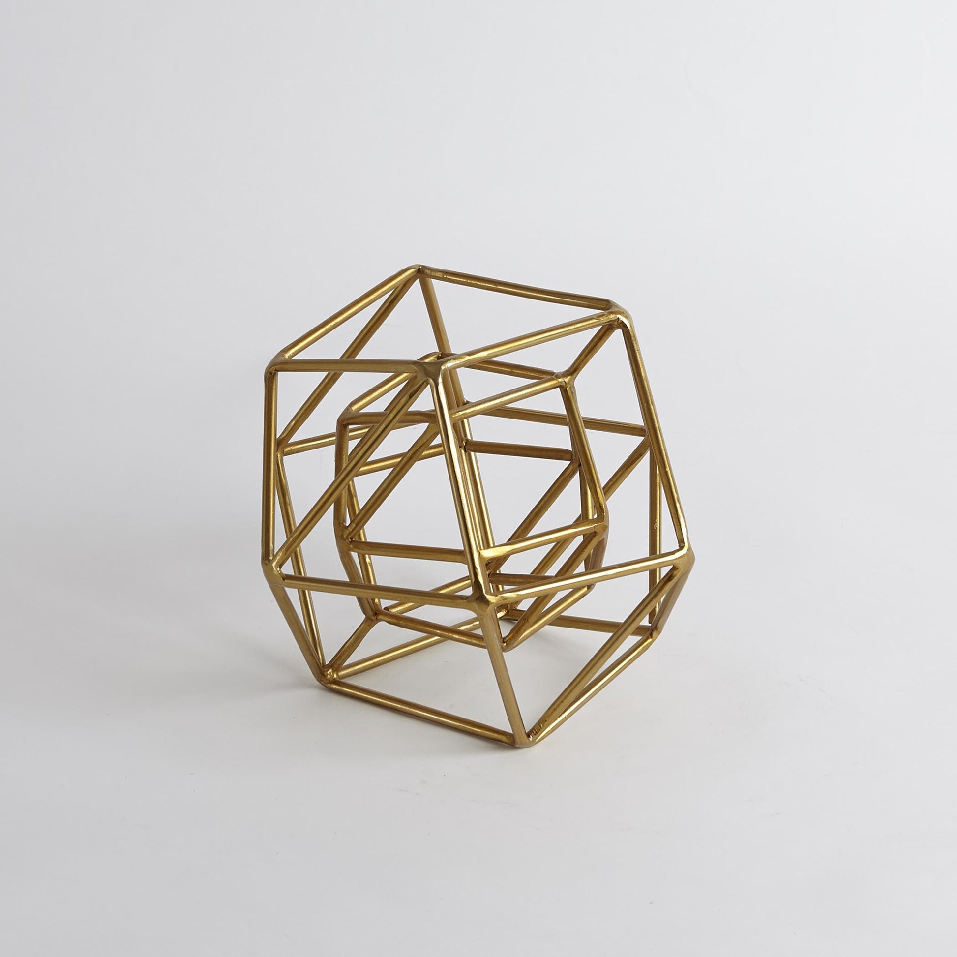 Geo Sculpture by Global Views in gold. Made from iron in a modern style.