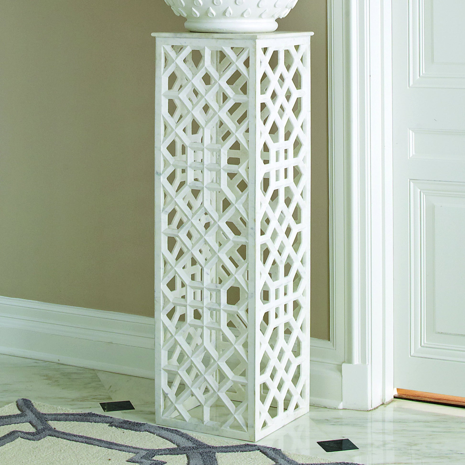 Fret Pedestal by Global Views. Made from hand carved honed white marble in a transitional style.