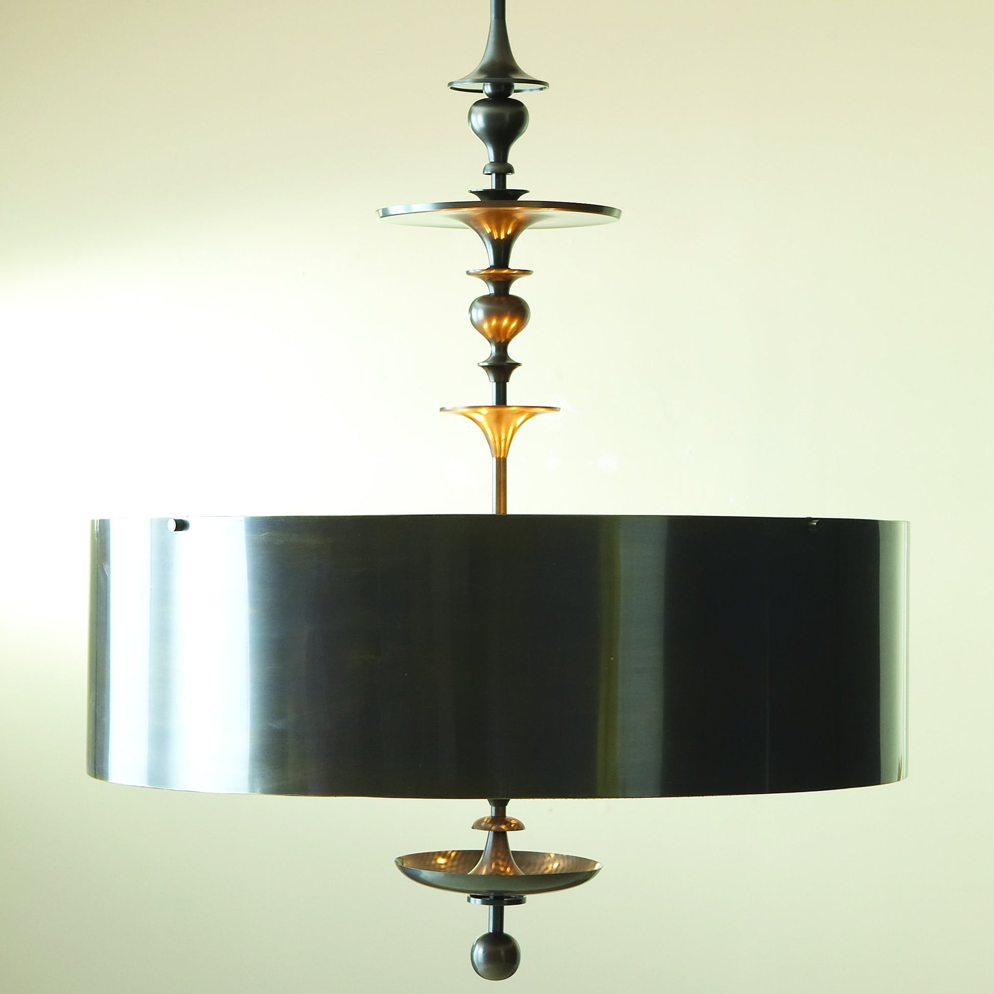 Turned Pendant Chandelier by Global Views in nickel. Made from unique in a transitional style.
