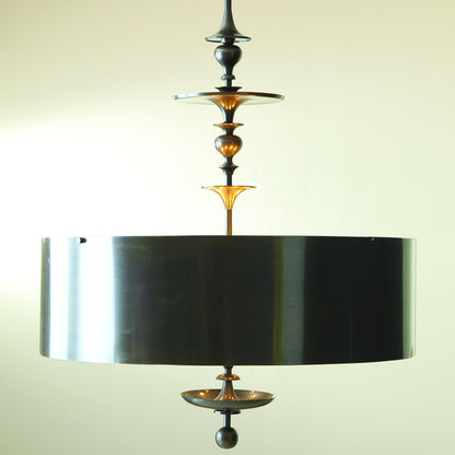 Turned Pendant Chandelier by Global Views in nickel. Made from unique in a transitional style.