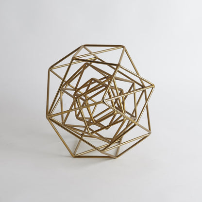 Geo Sculpture by Global Views in gold. Made from iron in a modern style.