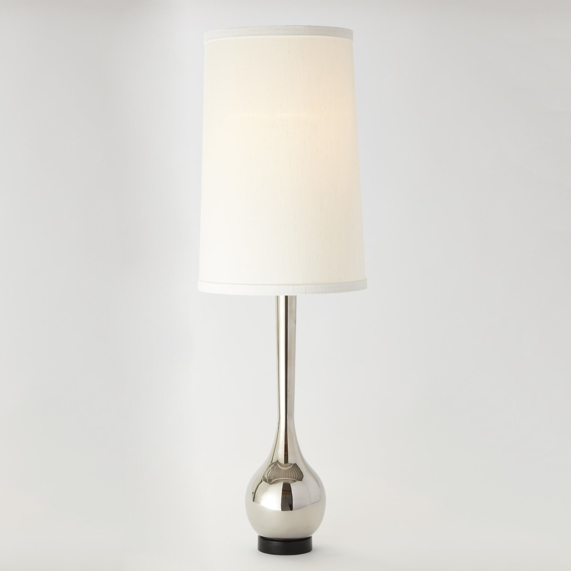 Bulb Vase Table Lamp by Global Views. Made from brass, black lime stone in a transitional style.