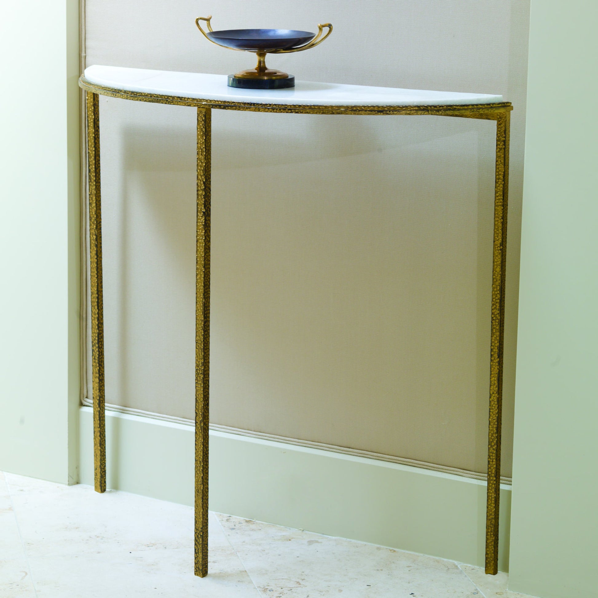 Hammered Console by Global Views. Made from unique in a transitional style.