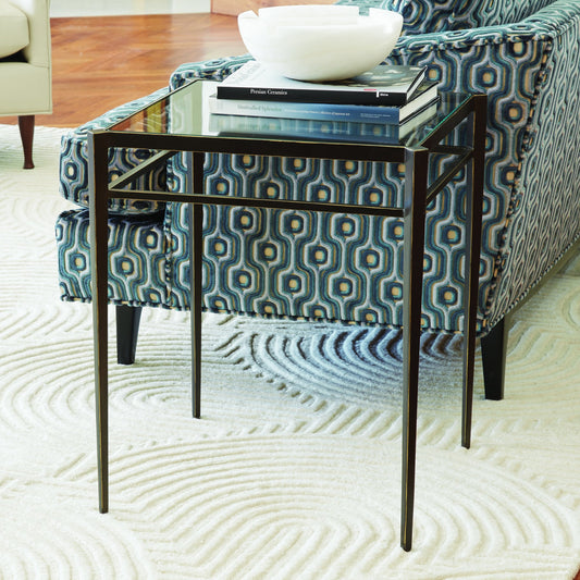 Lescot Side Table by Global Views in dark gunmetal bronze powder coat, gold edges, highlights. Made from iron, tempered glass in a modern style.