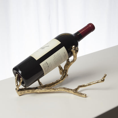 Twig Wine Bottle Holder by Global Views. Made from cast brass in a eclectic & global style.