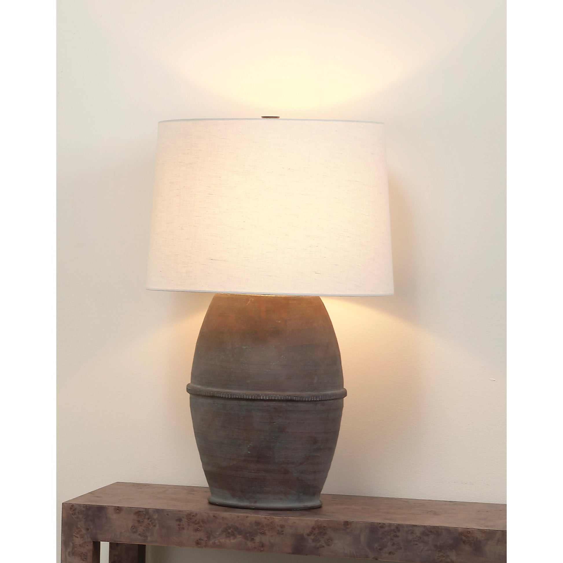 Antiquity Table Lamp by Jamie Young in dark grey. Made from ceramic in a modern style.