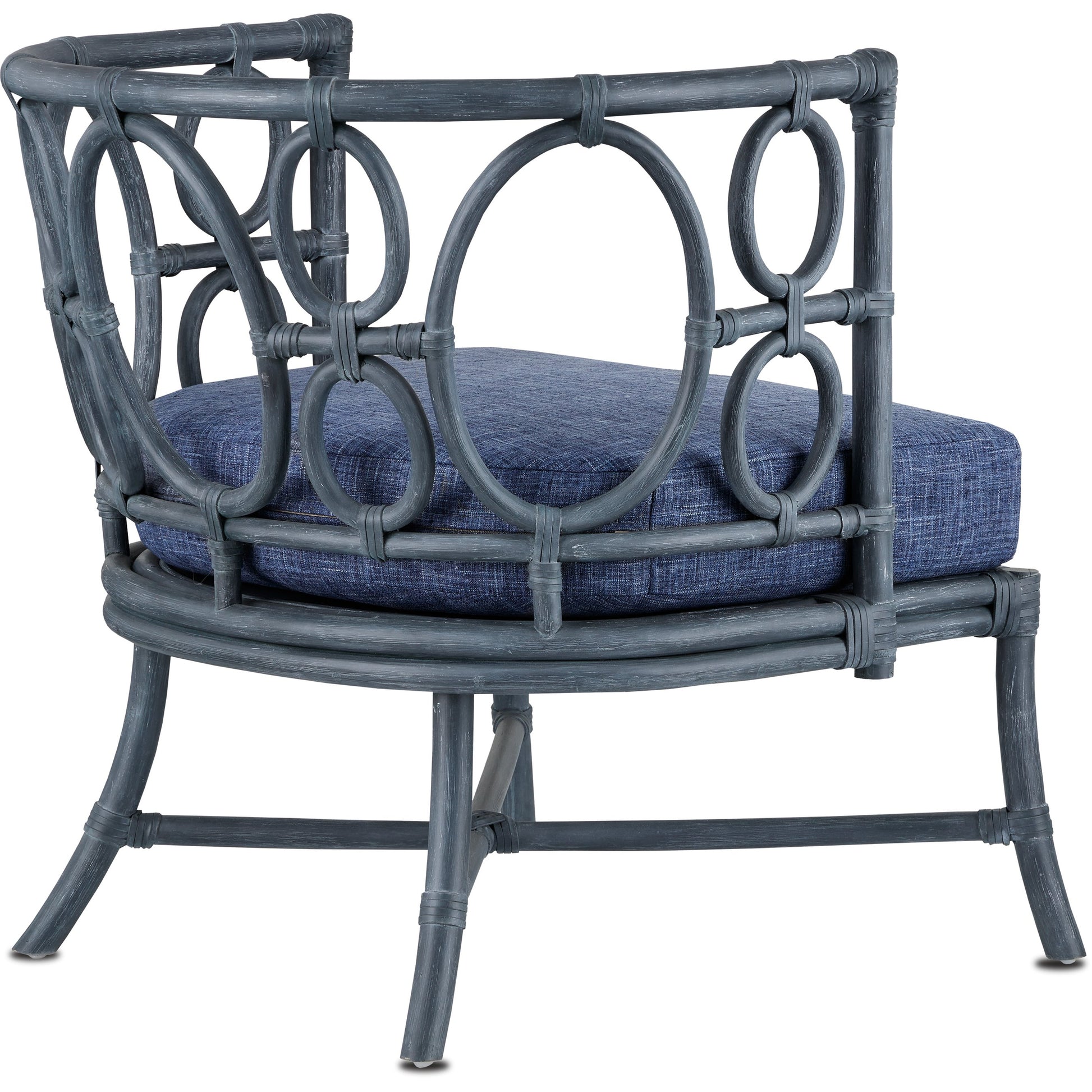 Tegal Chair by Currey and Company in vintage navy, indigo. Made from rattan, plywood, fabric, foam in a coastal style.