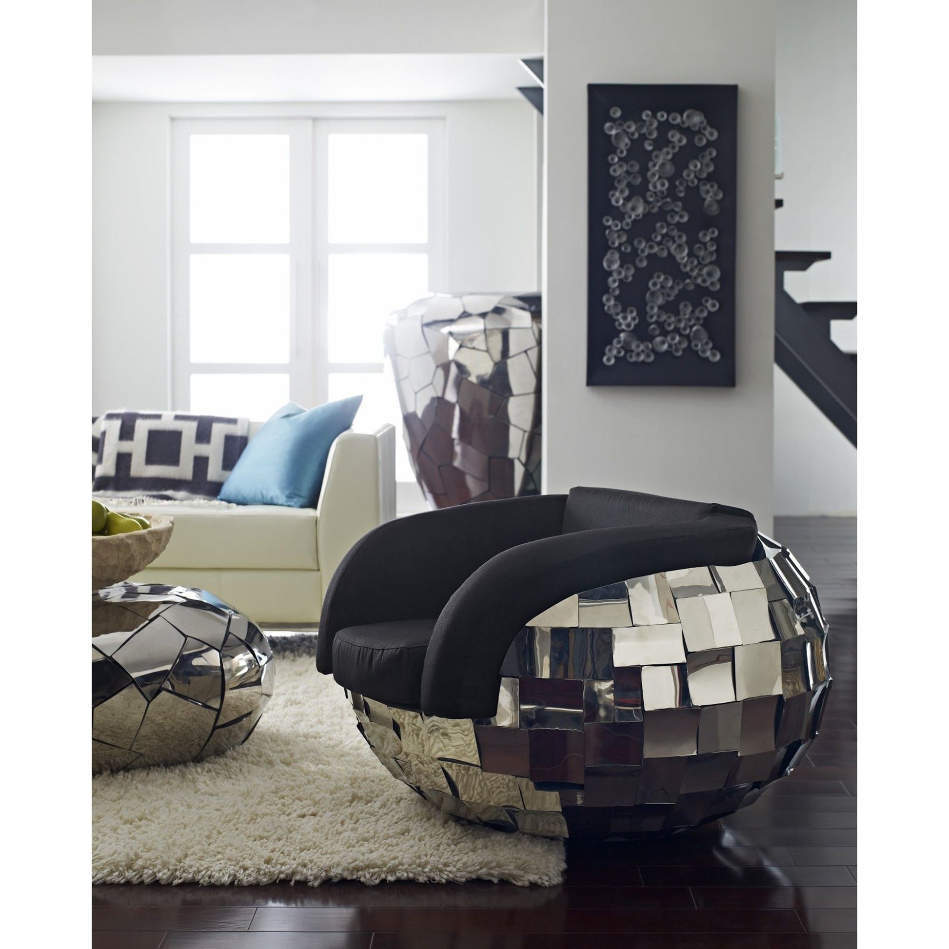 Crazy Cut Club Chair by Phillips Collection in silver. Made from metal in a modern style.