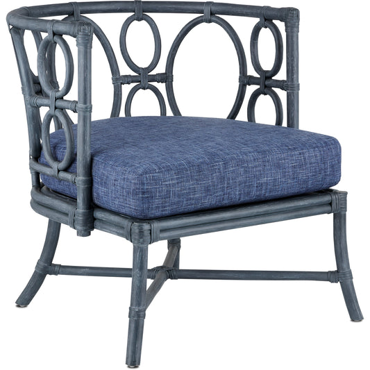 Tegal Chair by Currey and Company in vintage navy, indigo. Made from rattan, plywood, fabric, foam in a coastal style.
