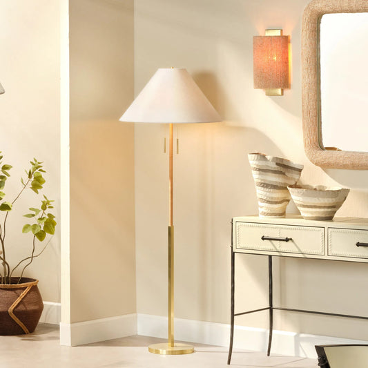 Harrison Floor Lamp by Jamie Young in antique brass and natural. Made from rattan in a unique style.