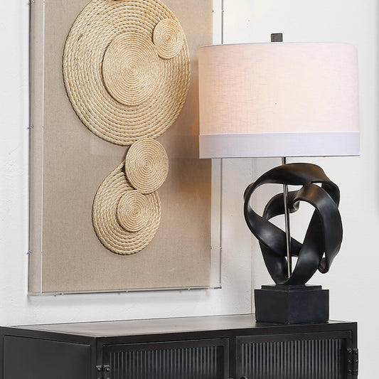 Intertwined Table Lamp by Jamie Young. Made from resin in a modern style.