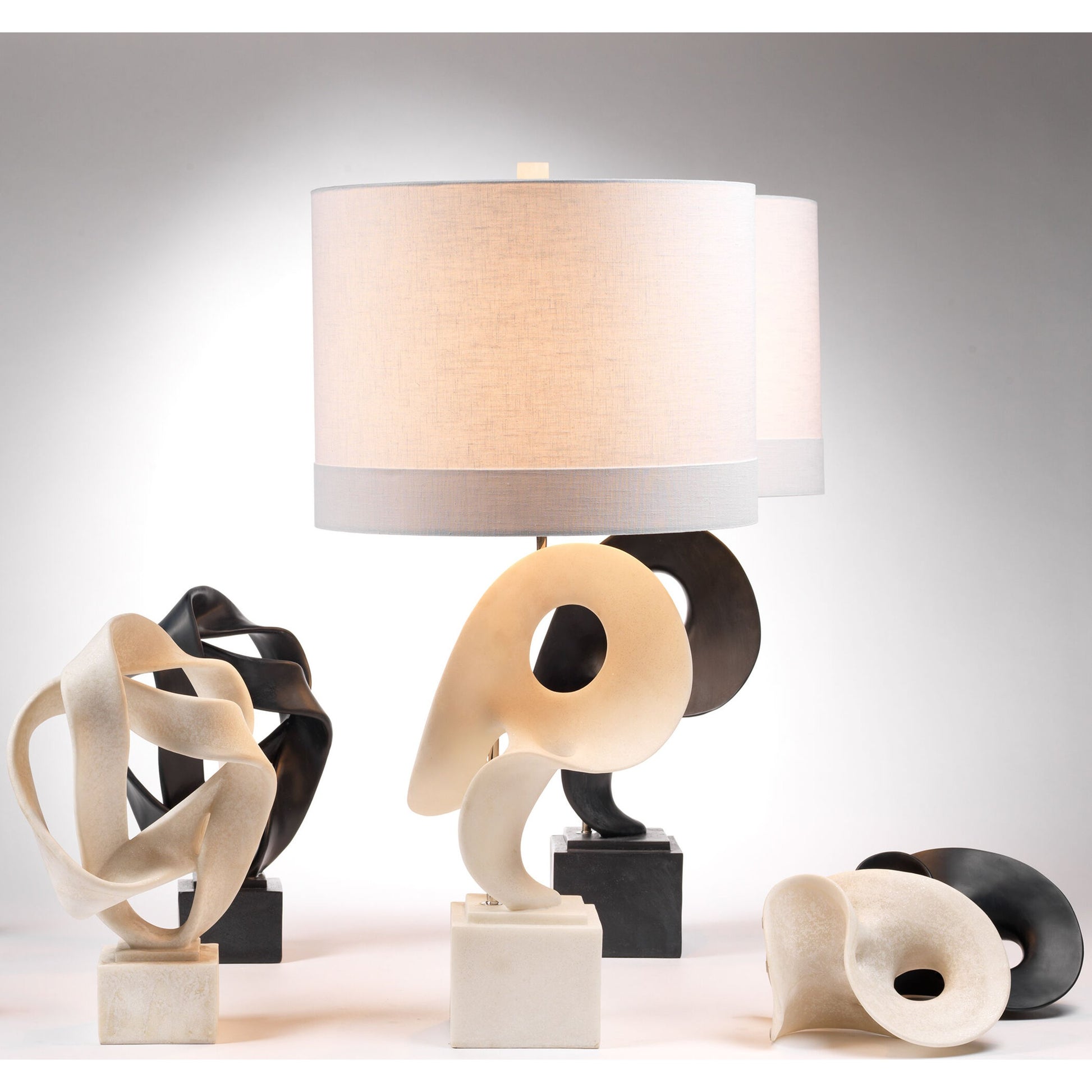 Obscure Table Lamp by Jamie Young in white polyresin. Made from resin in a modern style.