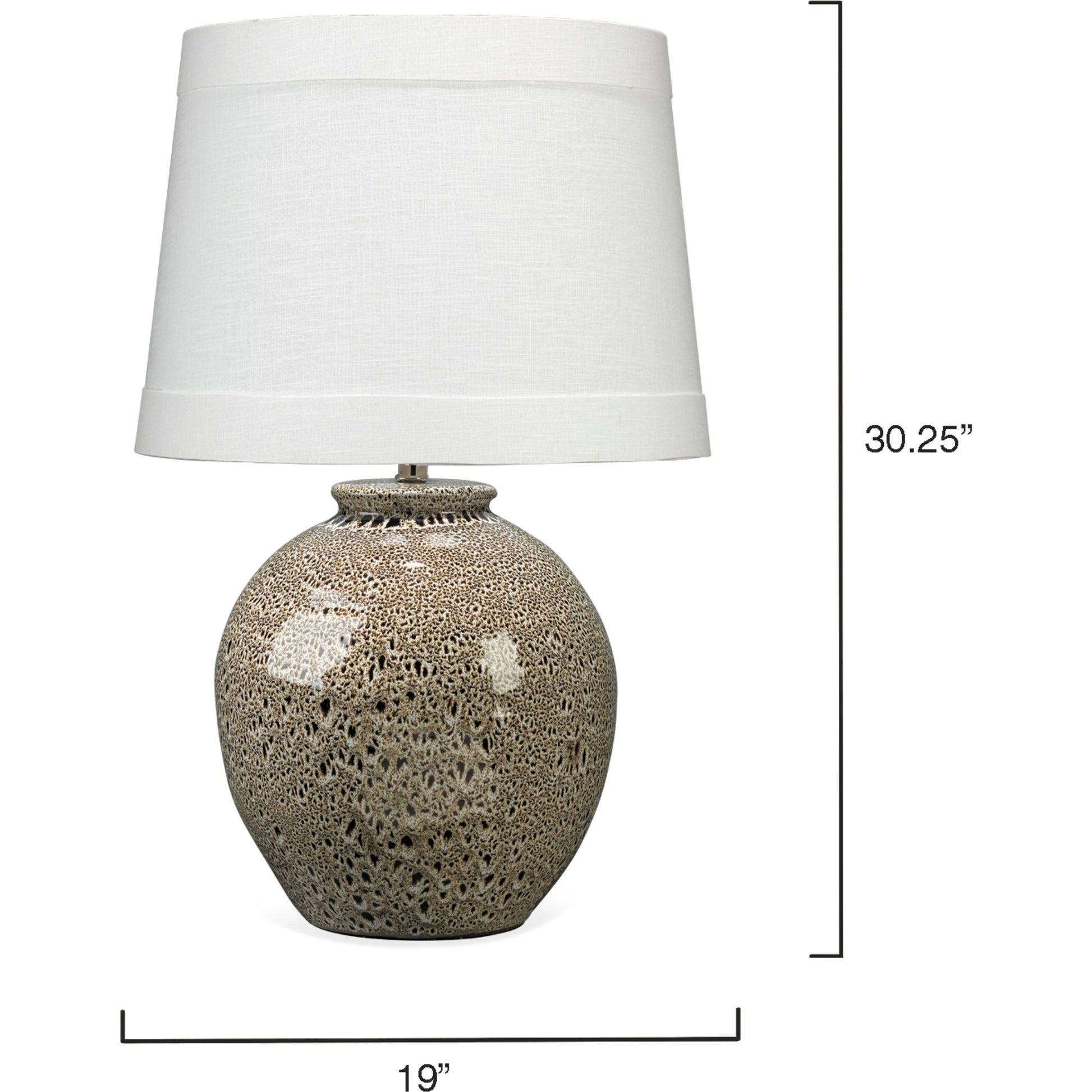 Vagabond Table Lamp by Jamie Young in brown. Made from ceramic in a transitional style.