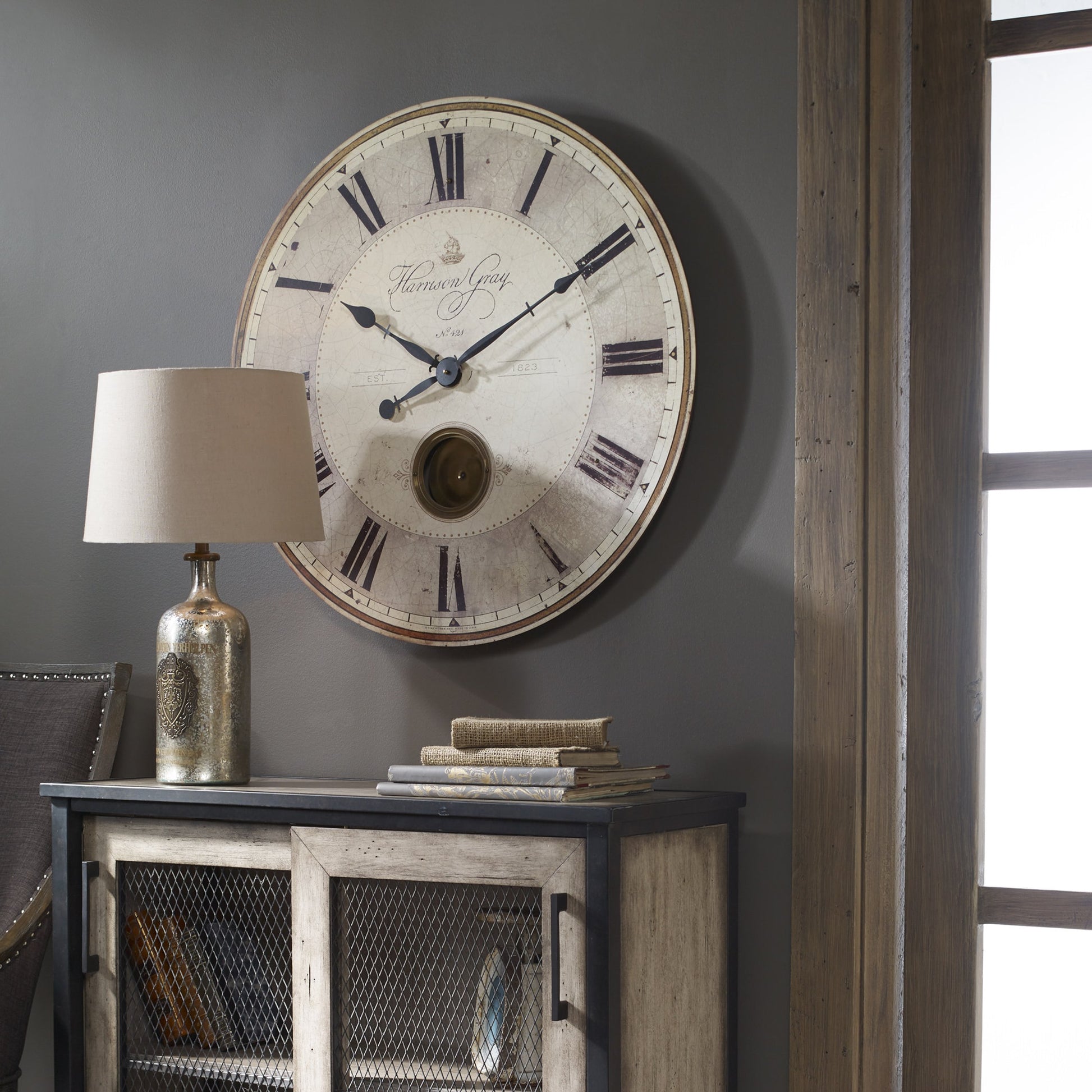 Harrison Clock by Uttermost in gray. Made from mdf, brass, aluminum in a traditional style.