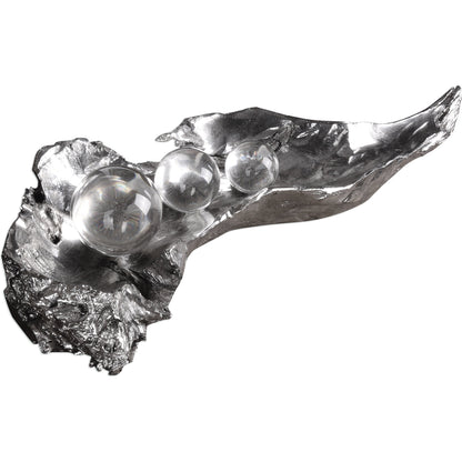 Three Peas in a Pod Metallic Sculpture by Uttermost. Made from resin, crystal in a modern style.