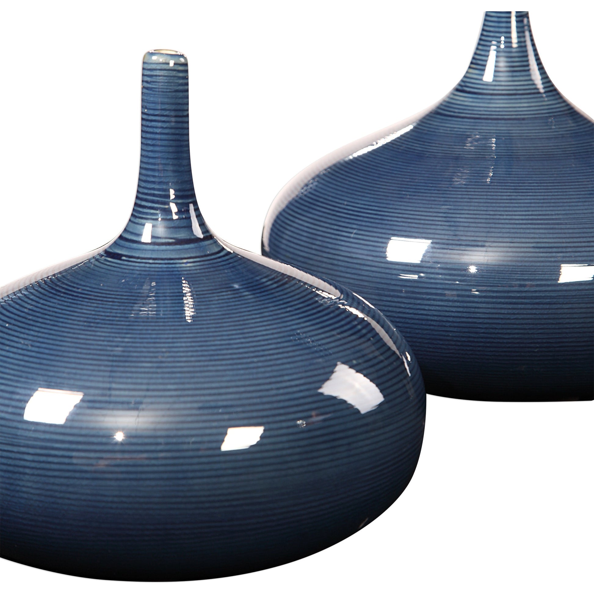 Zayan Blue Vases by Uttermost in blue. Made from ceramic in a transitional style.