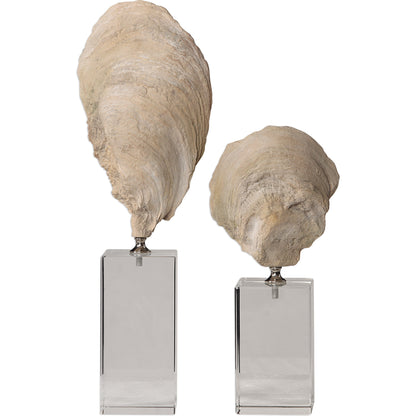 Oyster Shell Sculptures by Uttermost. Made from resin, crystal, stainless steel in a coastal style.