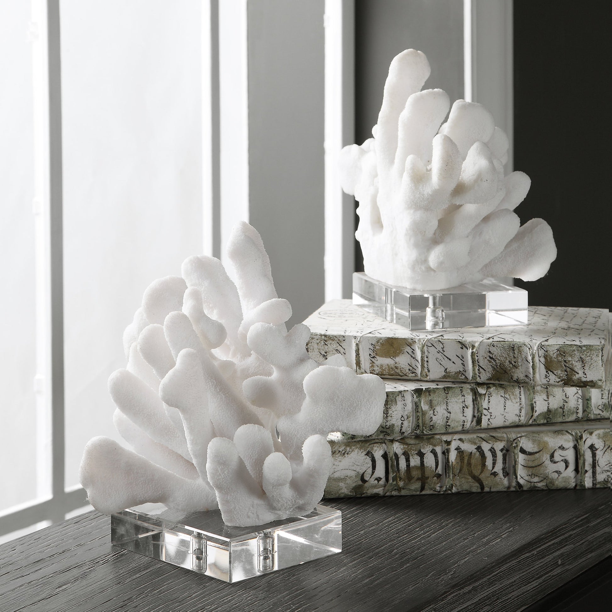 Charbel Bookends by Uttermost in white. Made from resin, k9cystal in a coastal style.