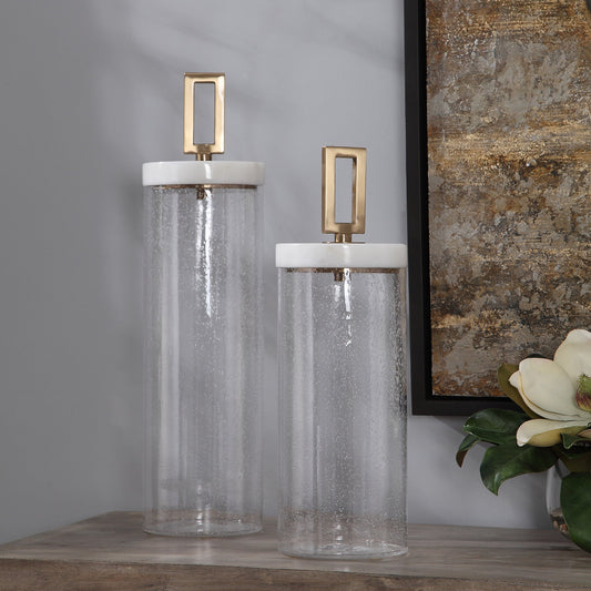 Hayworth Containers by Uttermost in white, brushed brass. Made from glass, marble, iron in a transitional style.