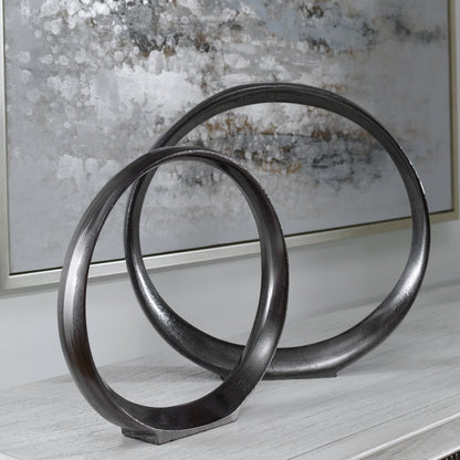 Orbits Ring Sculptures by Uttermost. Made from aluminum in a modern style.