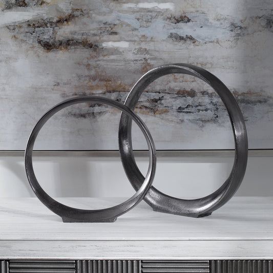 Orbits Ring Sculptures by Uttermost. Made from aluminum in a modern style.