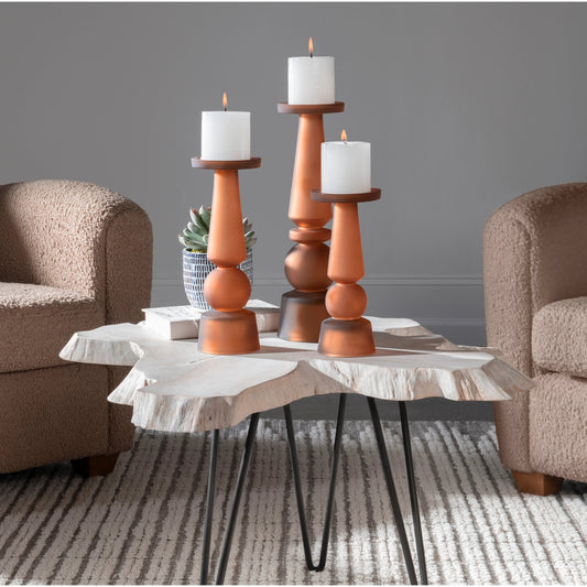Cassiopeia Candleholders by Uttermost in butter rum. Made from glass in a modern style.