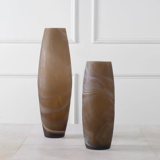 Delicate Swirl Vases by Uttermost in caramel. Made from glass in a modern style.