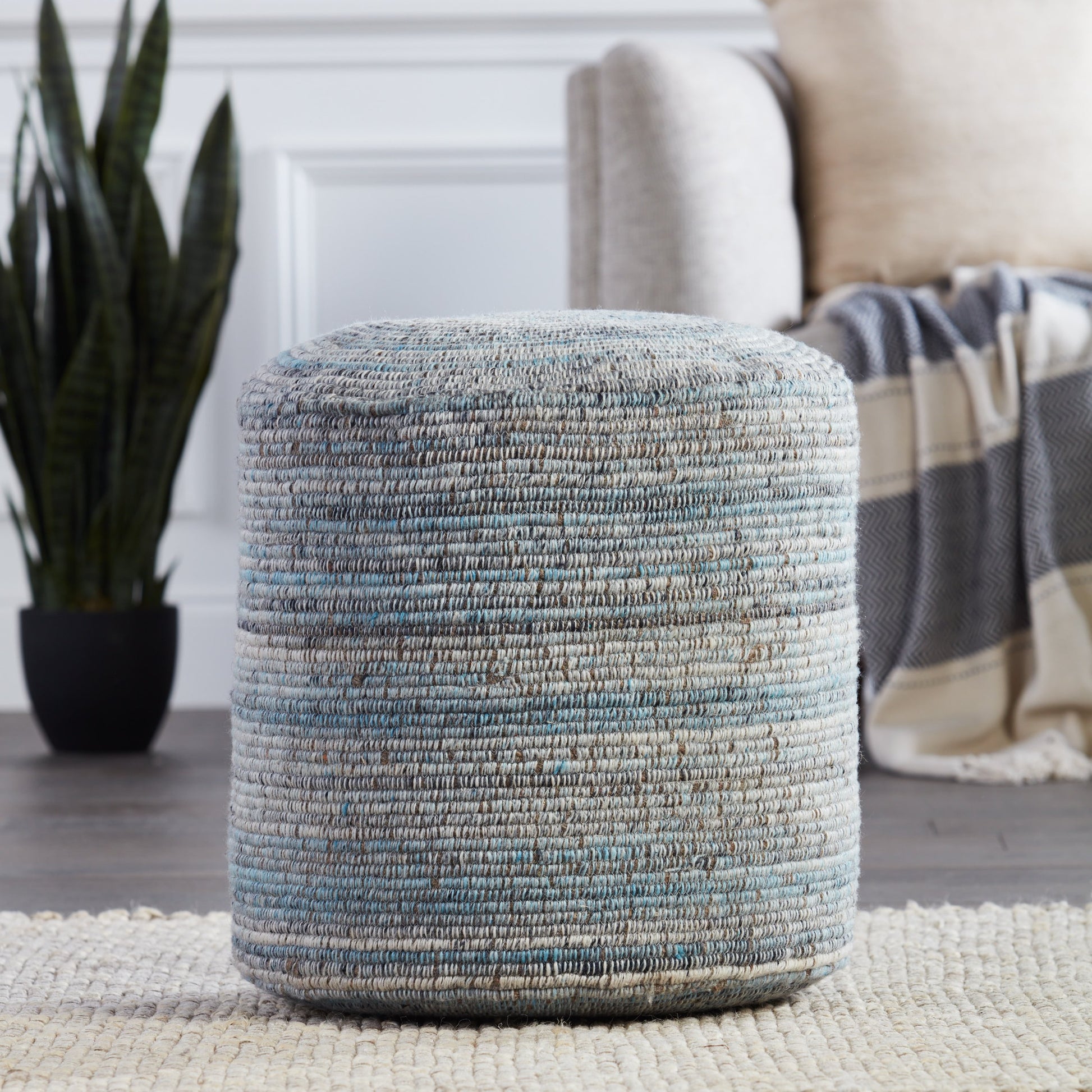 Amarillo AMR01 Pouf by Jaipur Living in light blue, gray. Made from 60% polyester, 40% wool in a eclectic & global style.
