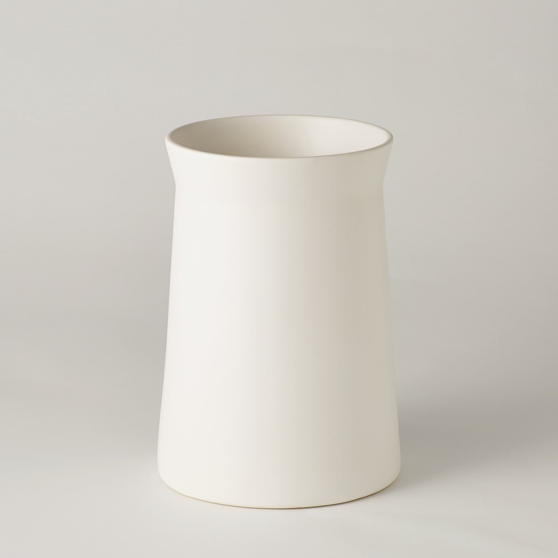Soft Curve Vase by Global Views in white. Made from ceramic in a modern style.