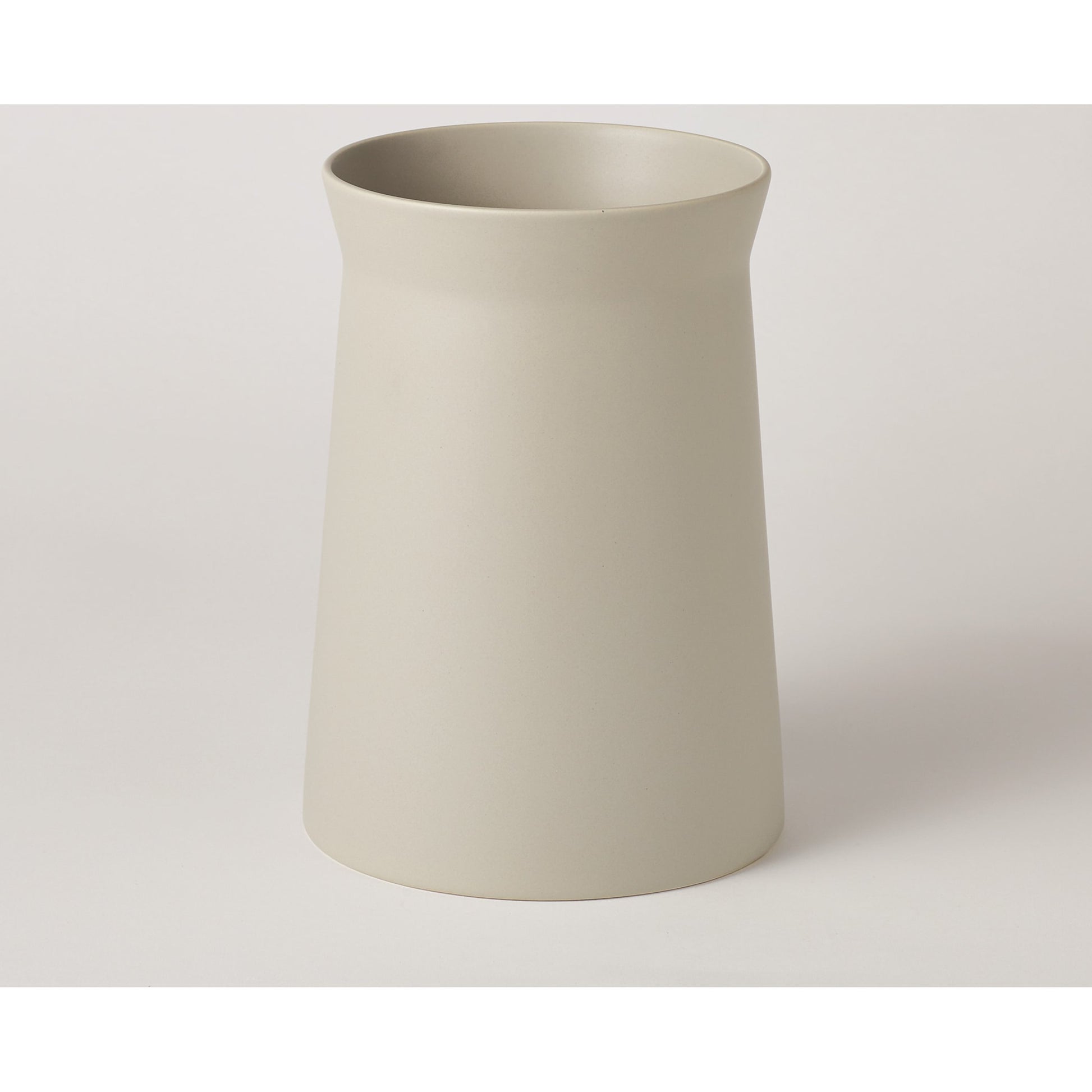 Soft Curve Vase by Global Views in white. Made from ceramic in a modern style.