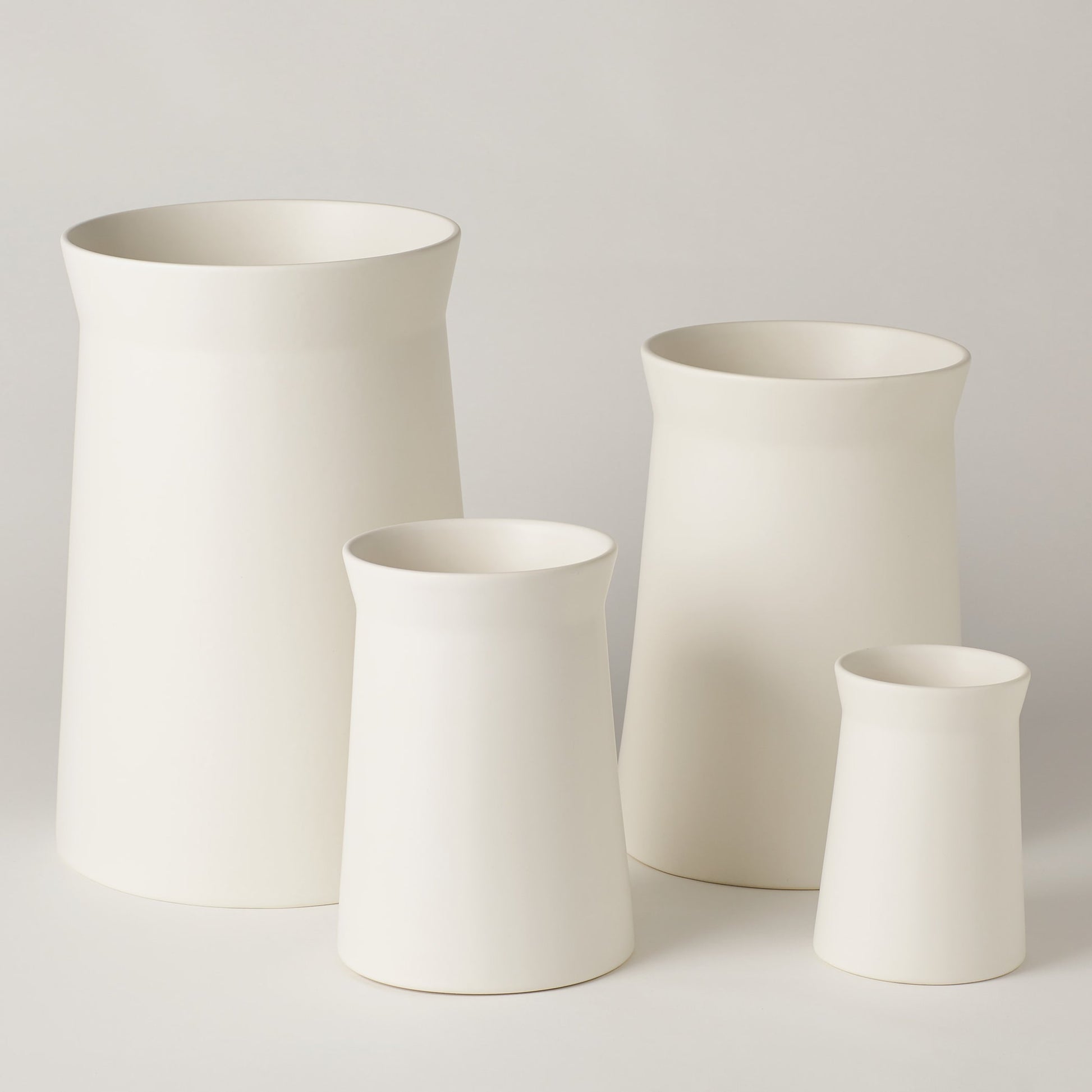 Soft Curve Vase by Global Views in white. Made from ceramic in a modern style.