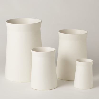 Soft Curve Vase by Global Views in white. Made from ceramic in a modern style.