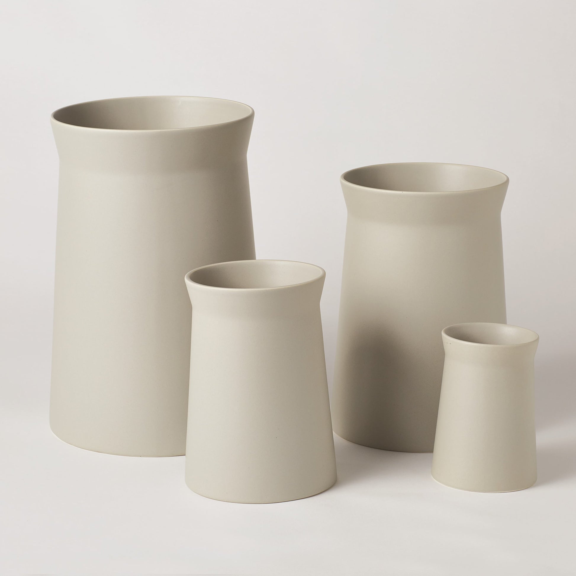 Soft Curve Vase by Global Views in white. Made from ceramic in a modern style.